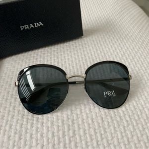 Prada 7AX 5Z1 Womens aviator polarized sunglasses. Black and silver.